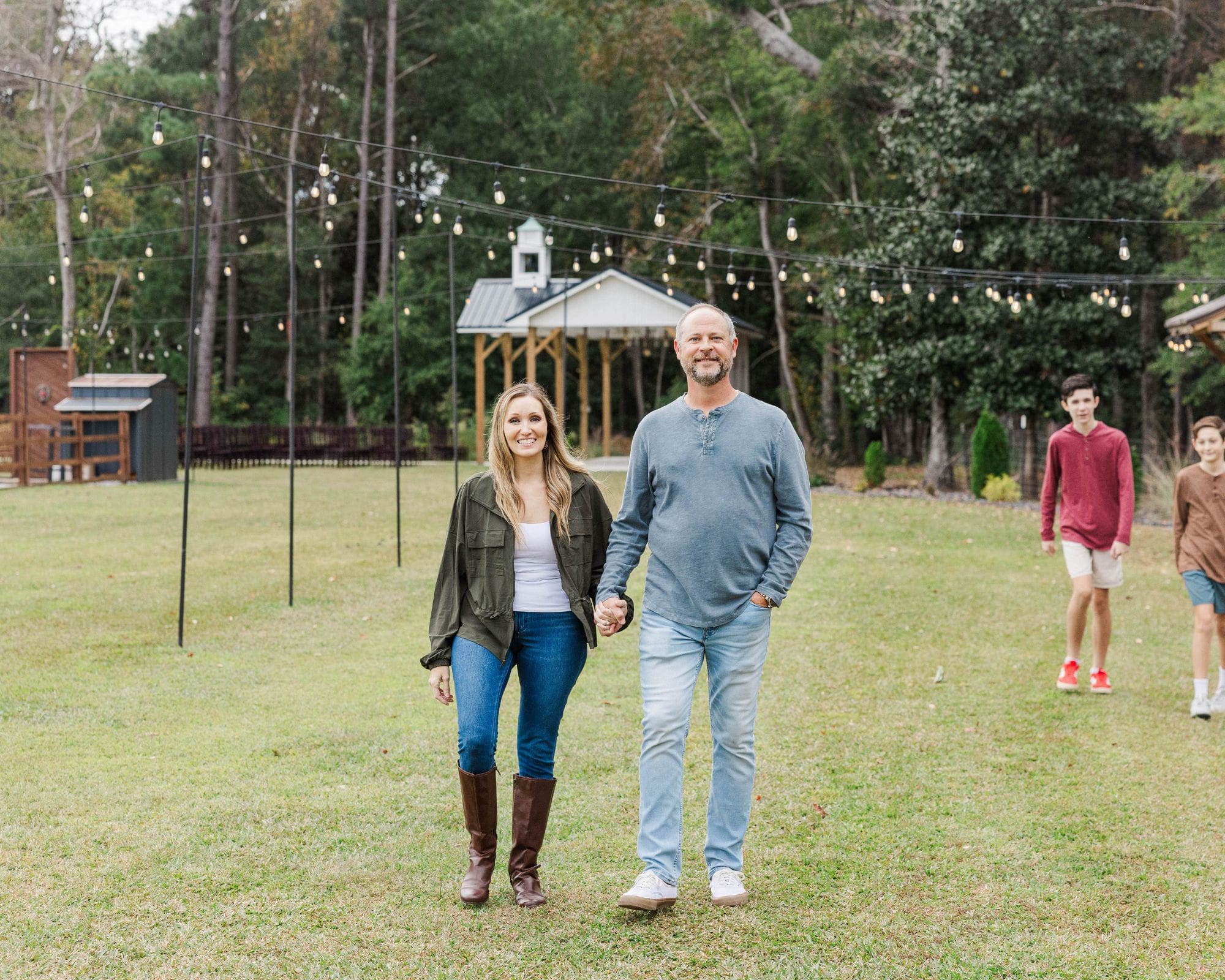 parents holding hands walking