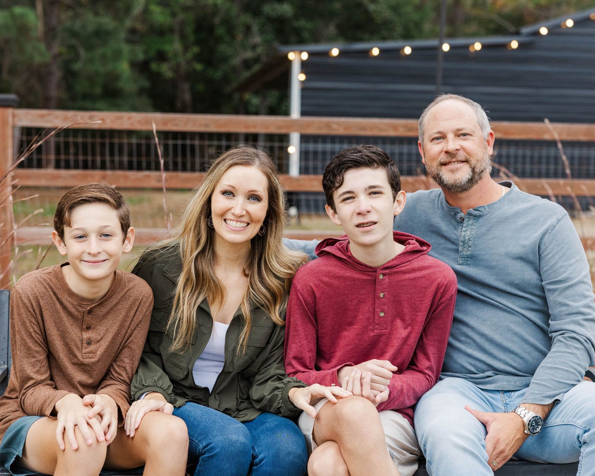 family sitting on a bench