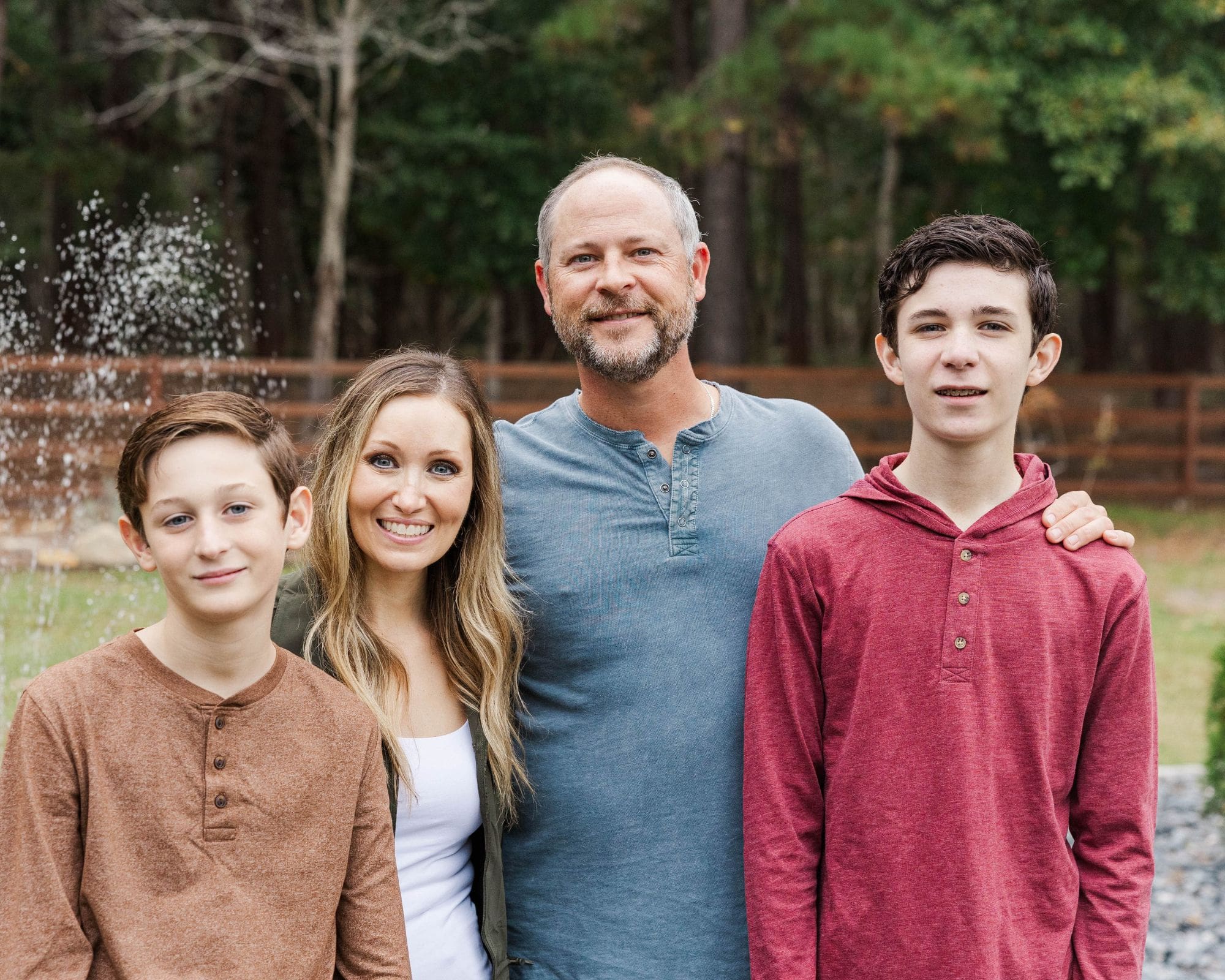 tight family hug captured outdoors on a peaceful farm in Eastern North Carolina